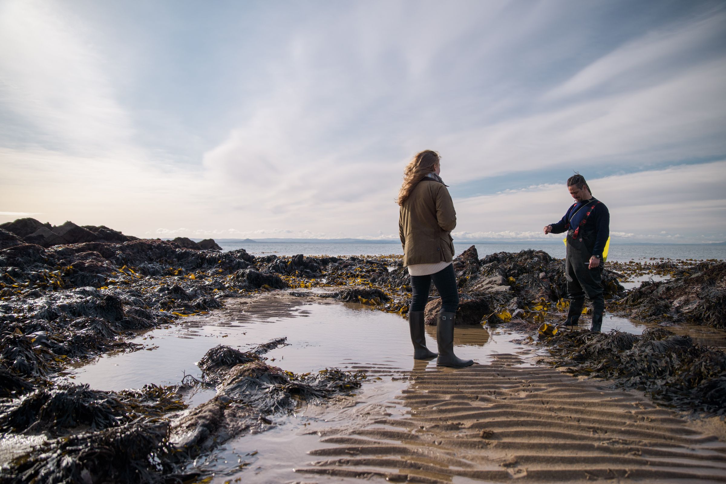 Two foragers under big skies at the rockpools