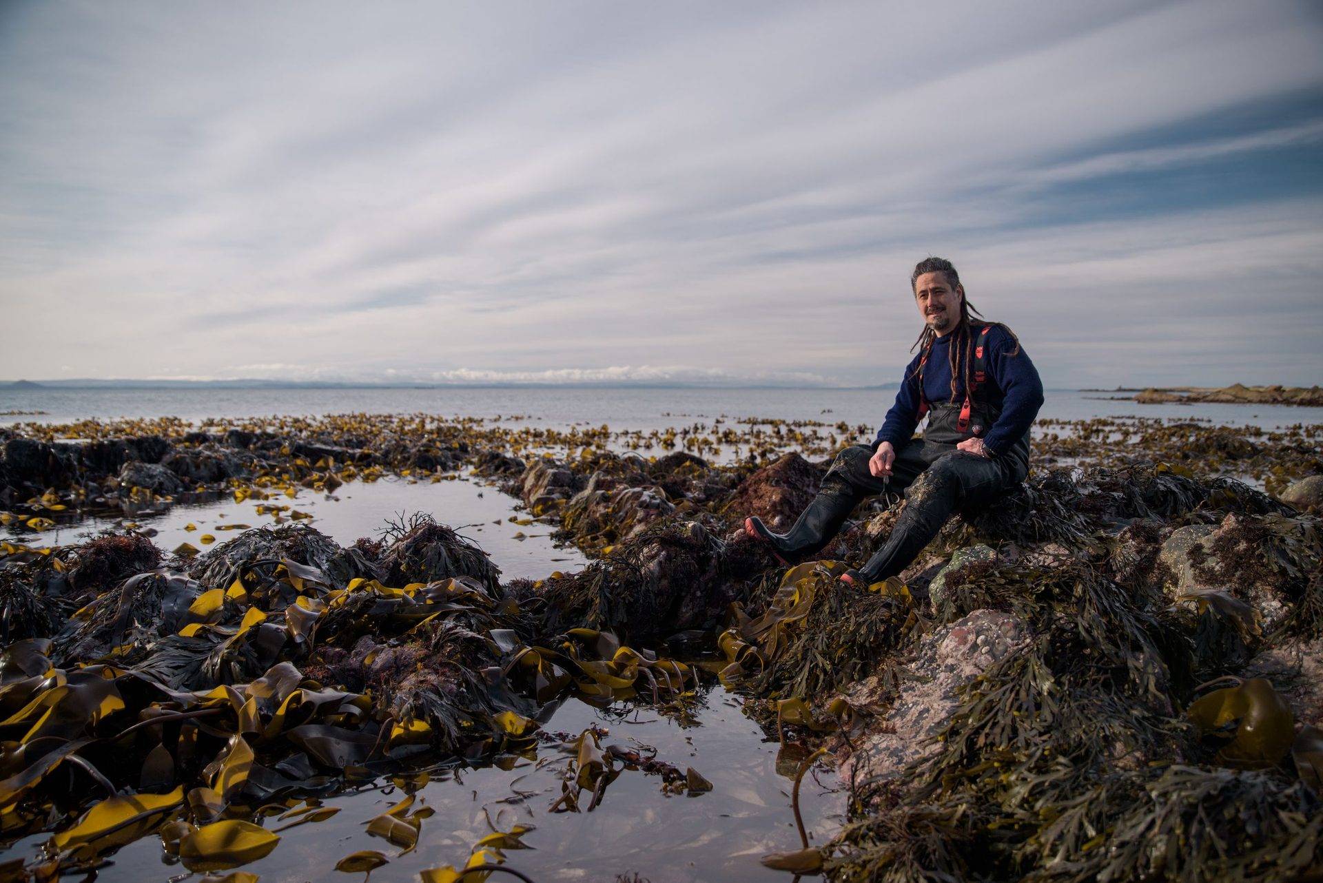 Jayson Byles foraging on the rocks