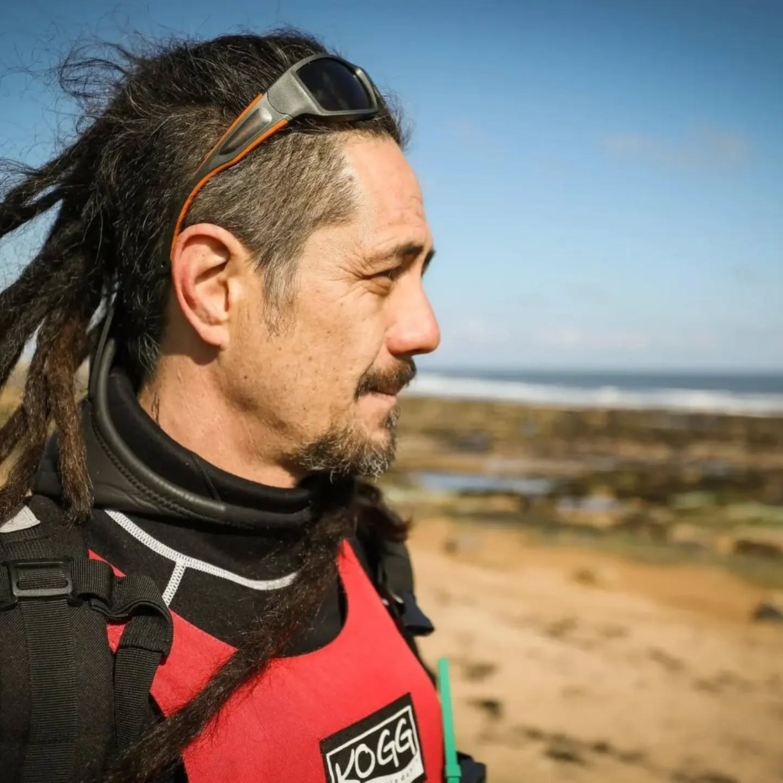 Jayson Byles looking out over the shore at low tide