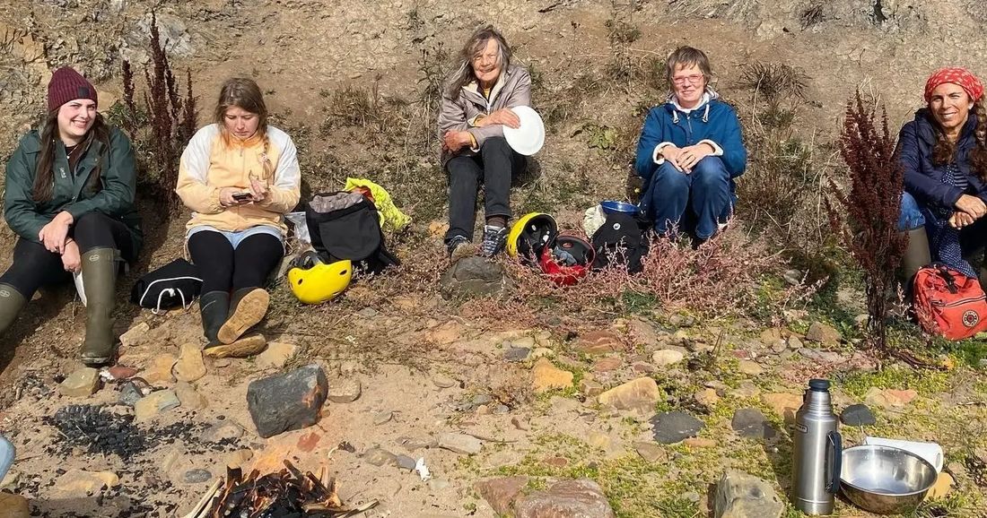 A workshop group resting on the East Neuk shore