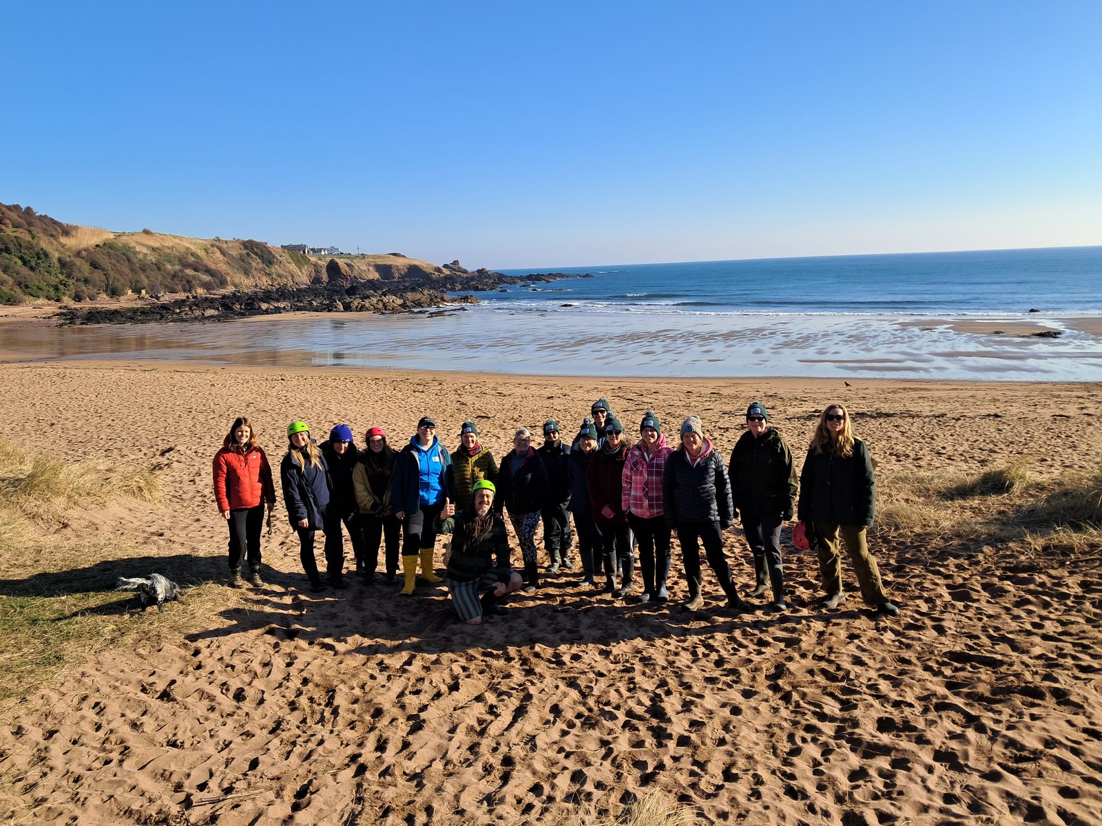 A workshop group on the sands at low tide, East Neuk