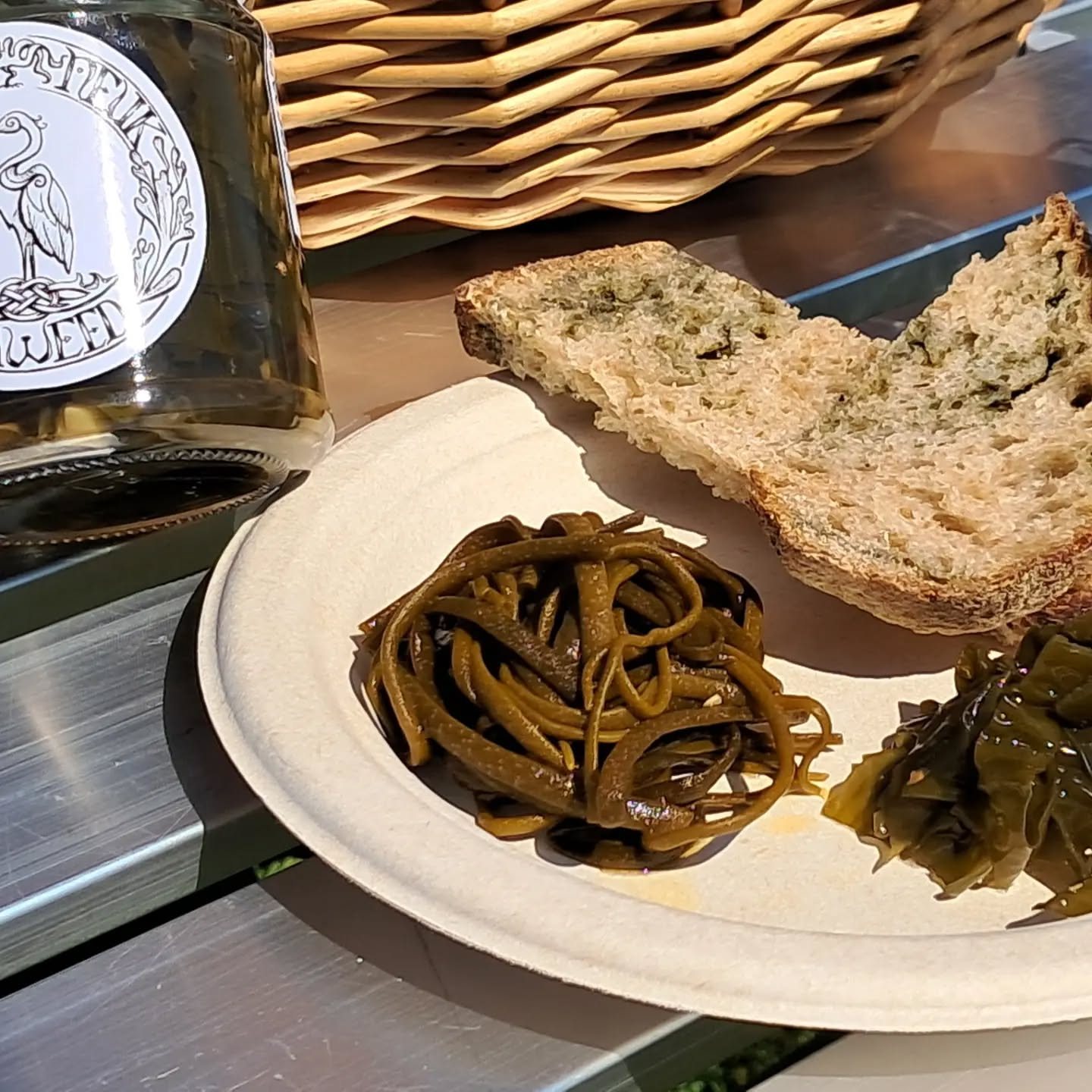 Sea spaghetti and dulse on a plate with a slice of bread